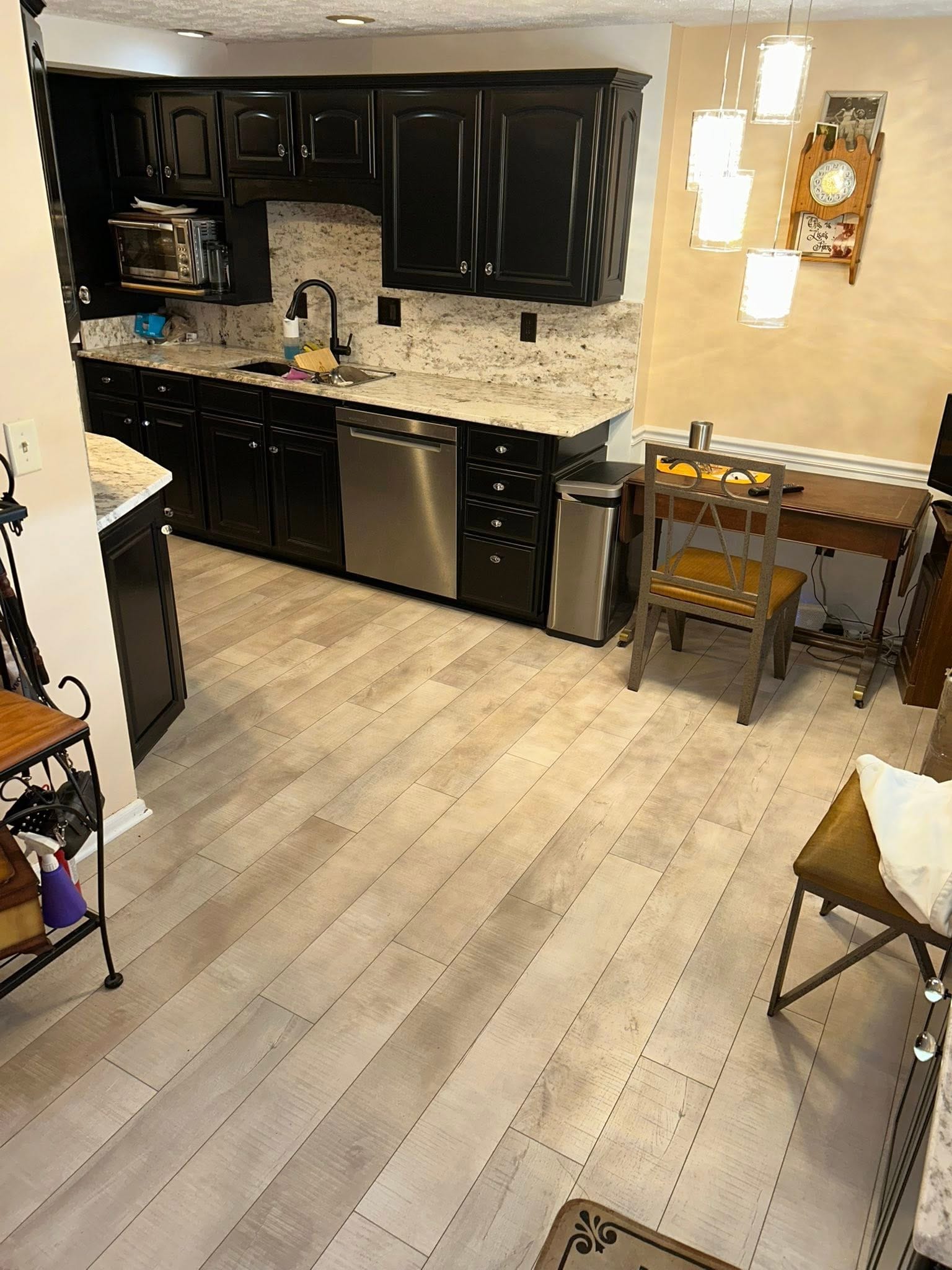 Open kitchen with hardwood flooring